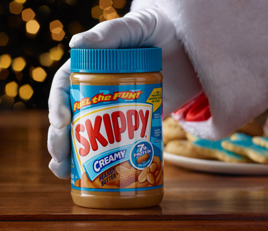 Santa hand with peanut butter jar