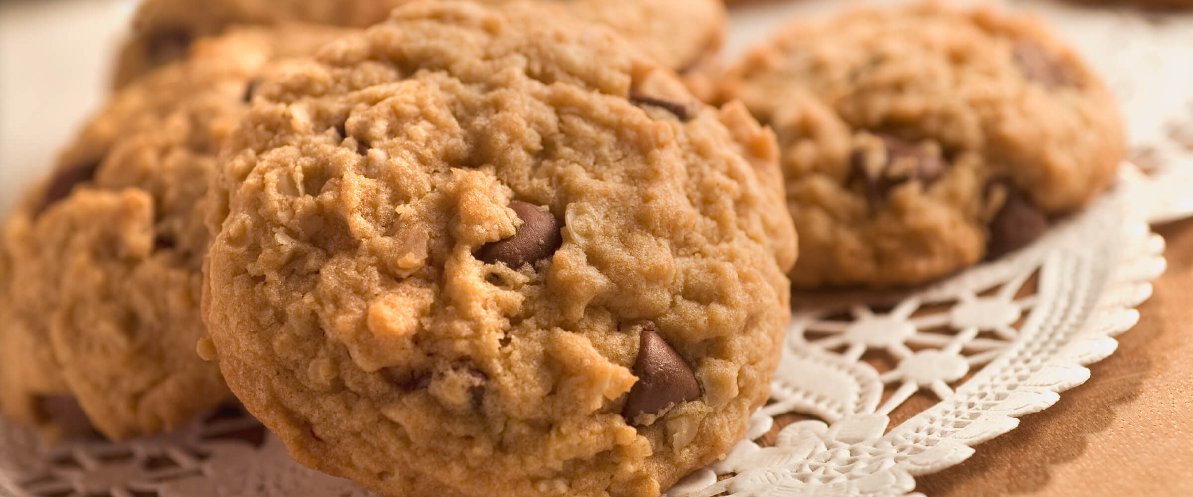 Peanut butter oatmeal cookies on a white doily