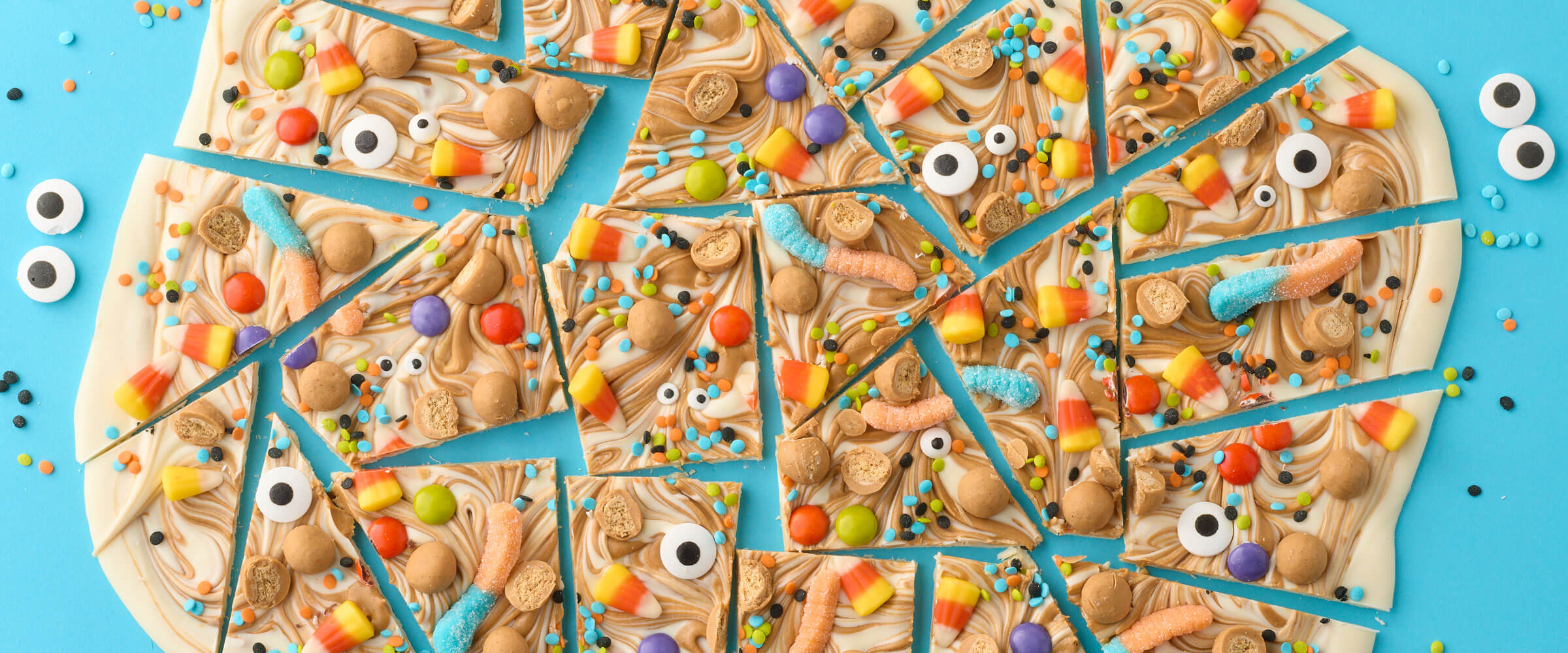 Peanut butter bark covered in Halloween themed candies