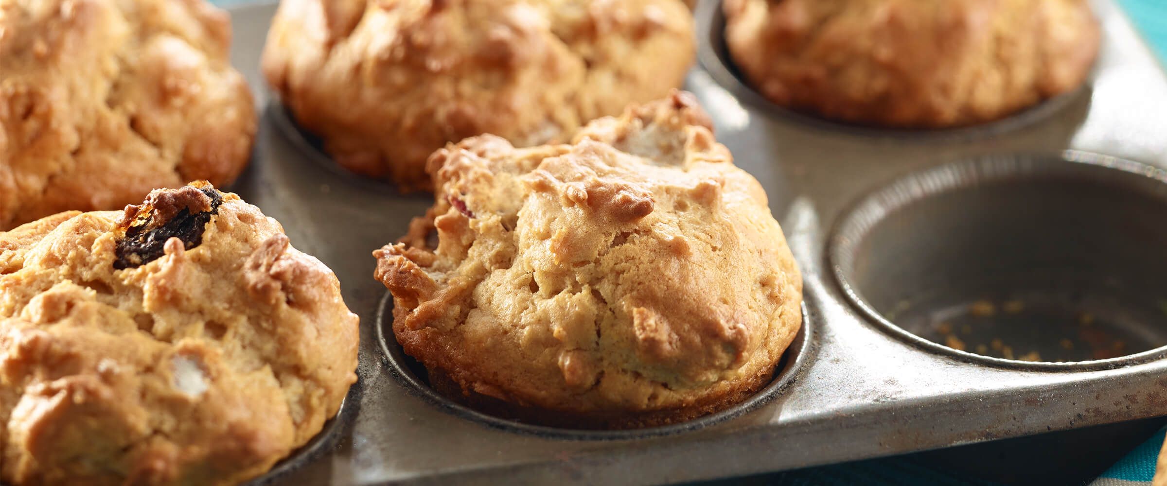 Peanut butter breakfast muffins in a muffin tin.