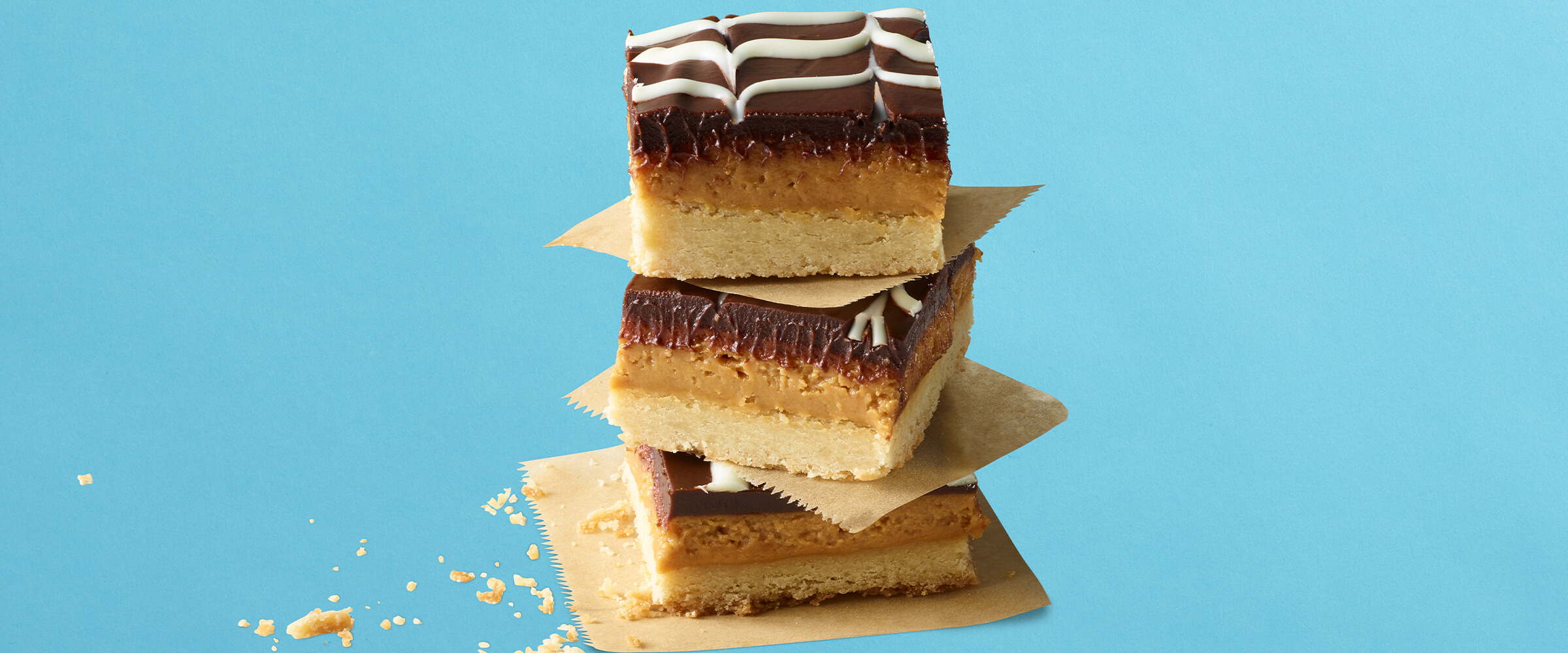 Three millionaire bars stacked on top of each other on a teal background