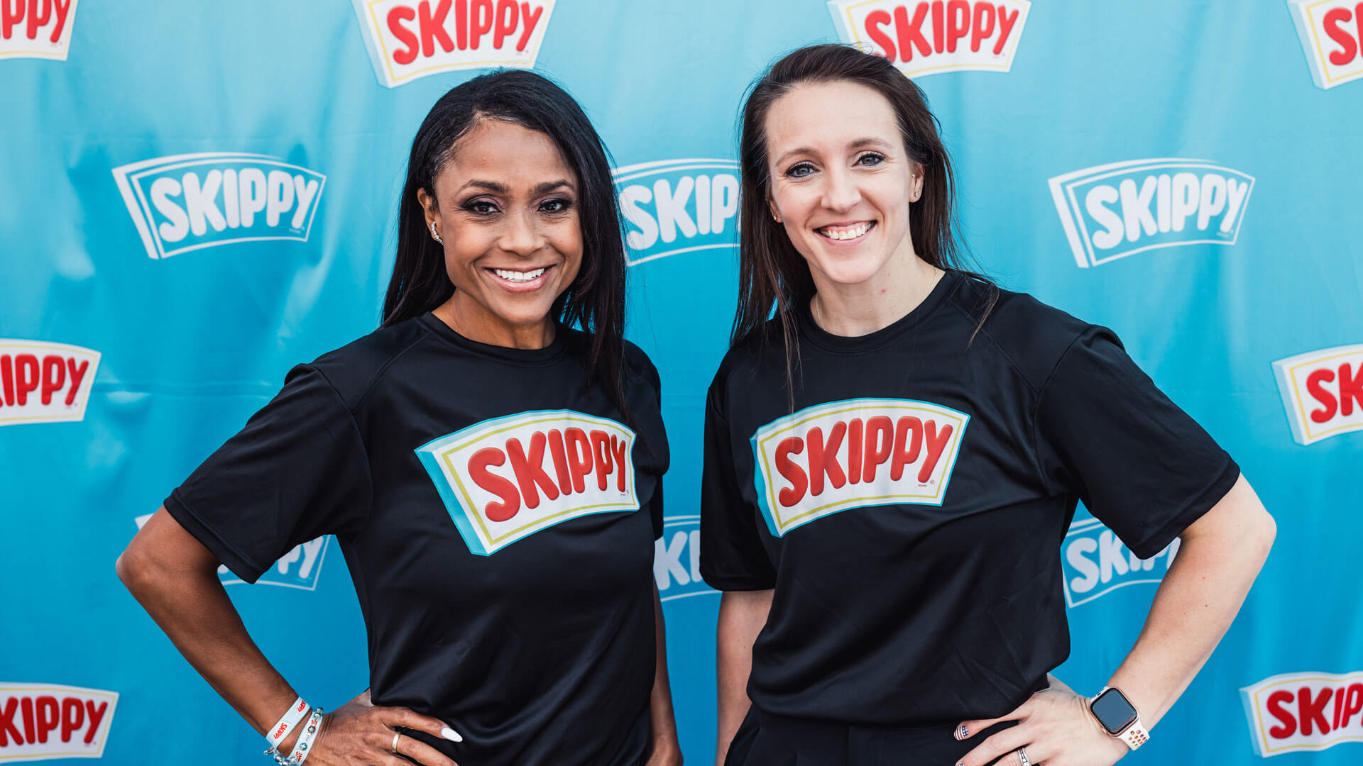 Gymnastics Legends Dominique Dawes and Chellsie Memmel in SKIPPY branded T-shirts